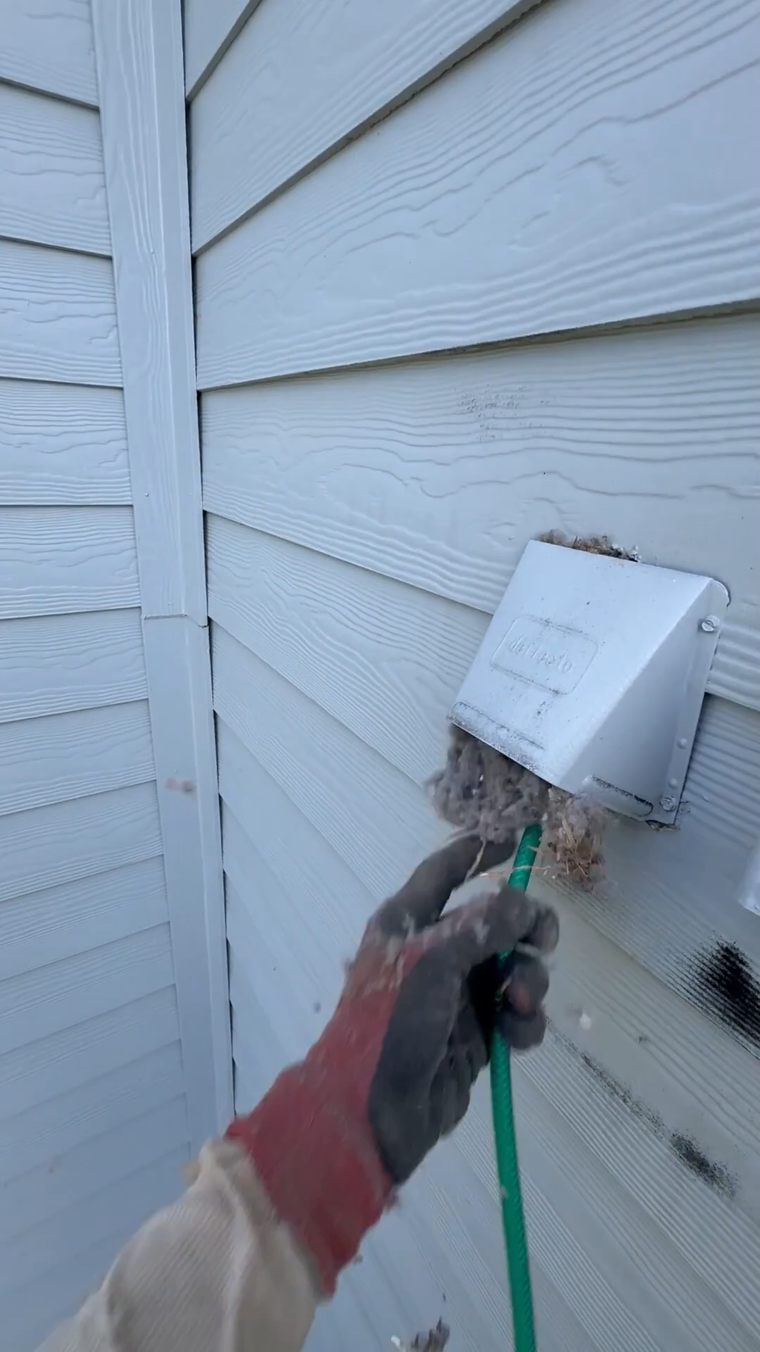commercial dryer vent being cleaned.